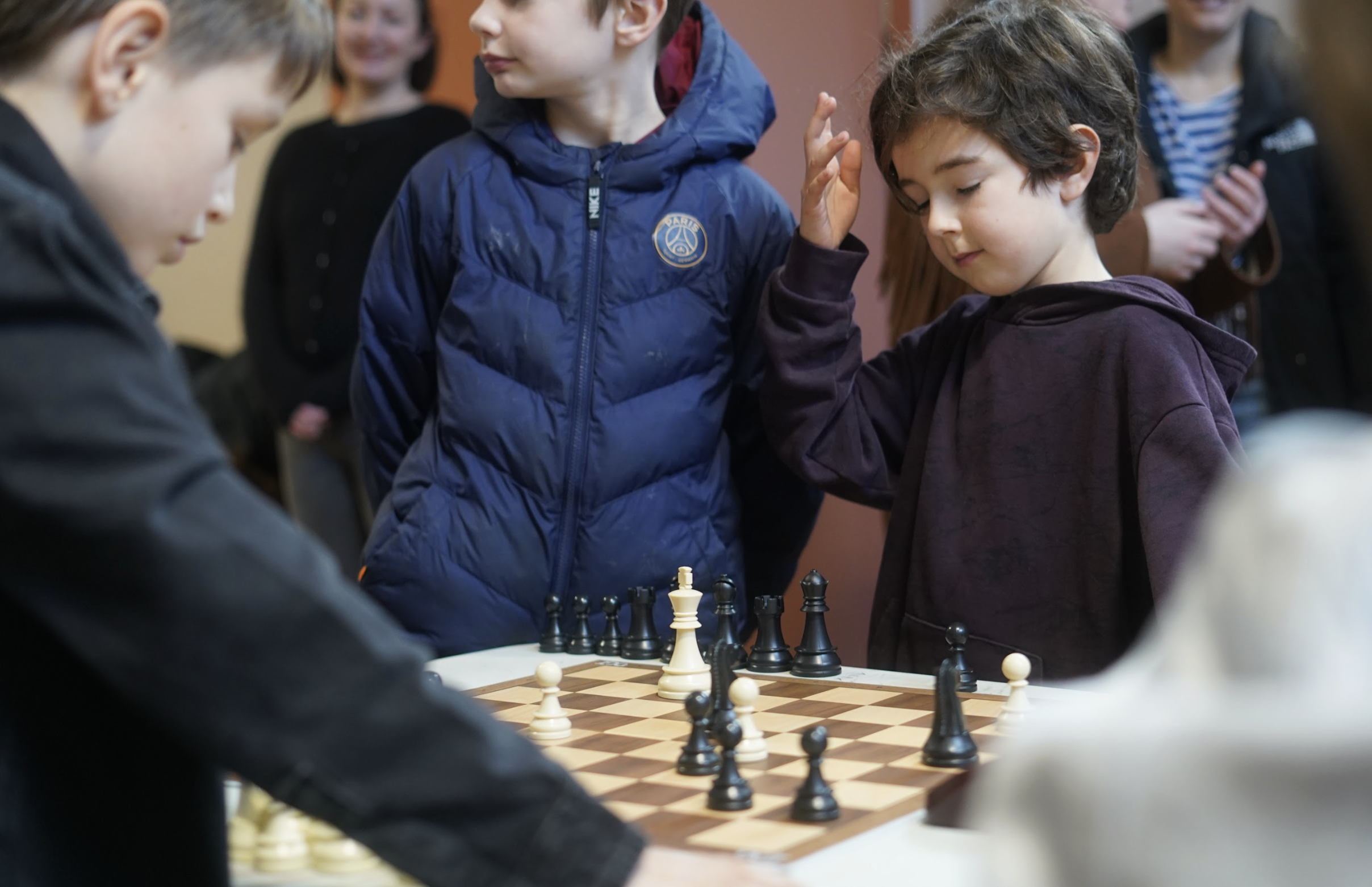 Instructor supervising chess club